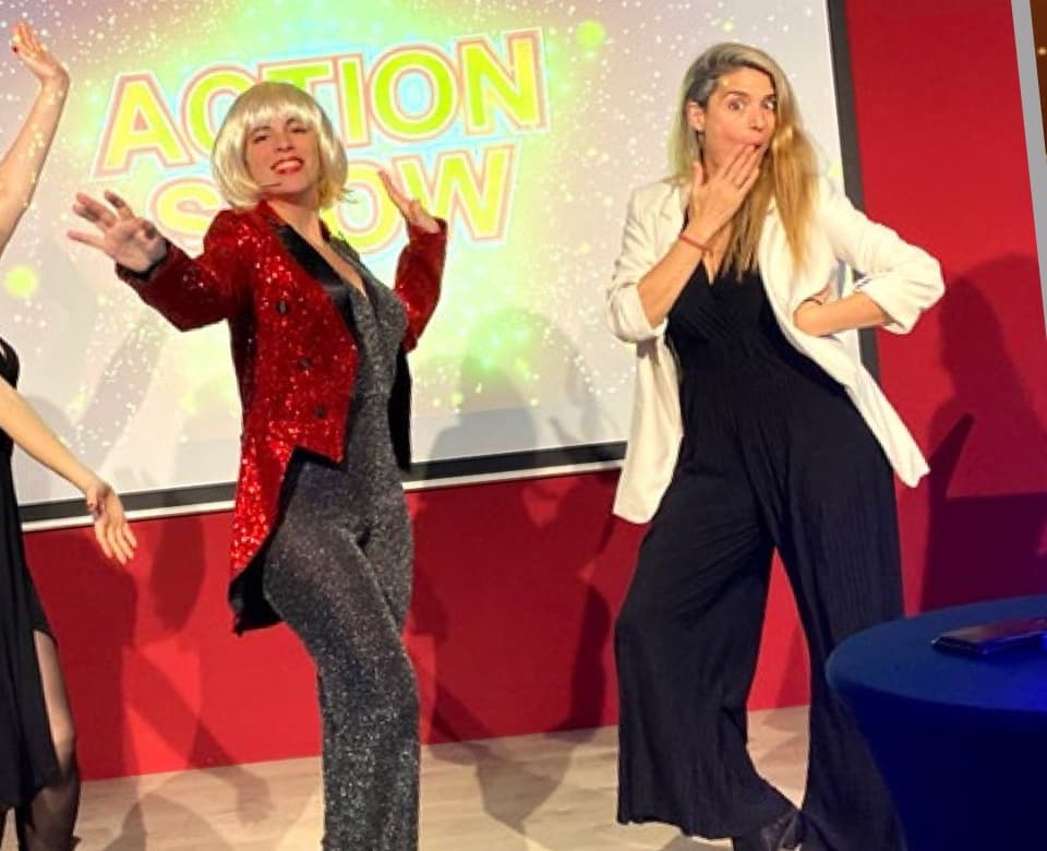 Host Antonella Mascarpone on the Action Show set during a corporate game show team building in Barcelona